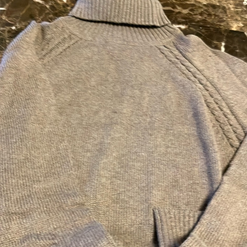Pretty women’s turtle neck sweater with raglan cable sides and pockets